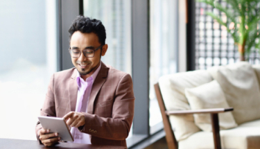 Man working on a tablet in a co-working office